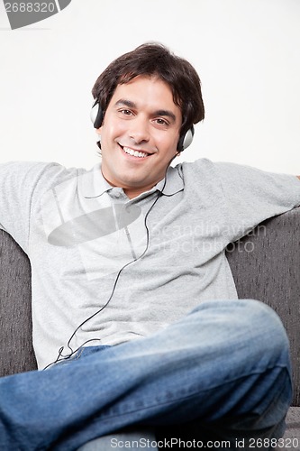 Image of Relaxed Young Man on Couch