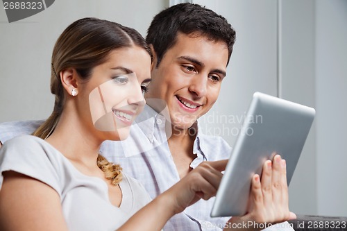 Image of Young Couple With Tablet PC