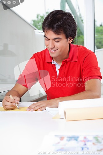Image of Architect Drafting a Blueprint