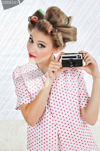 Image of Woman Holding Vintage Camera