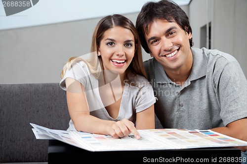 Image of Couple Choosing Color Samples