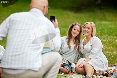 Image of Male Taking Picture of Friends