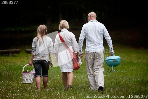 Image of Friends in Park with Barbecue