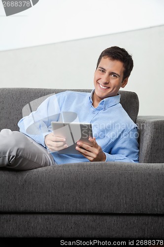 Image of Happy Man Holding Digital Tablet