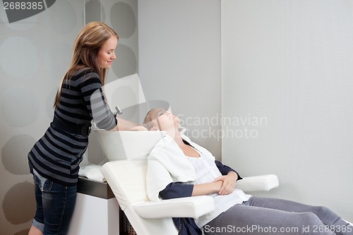 Image of Beautician Washing Hair Of Customer