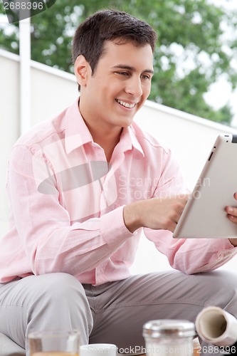 Image of Young Architect Using Digital Tablet