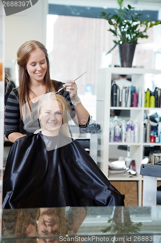 Image of Woman Getting Hair Highlighted