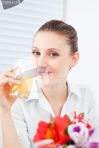 Image of Young Woman Drinking Juice
