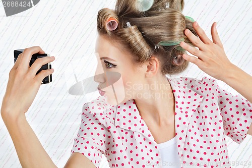 Image of Woman Self Photographing Herself