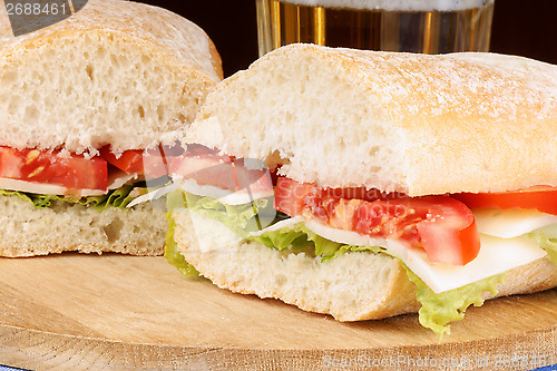 Image of Italian panino sandwich and beer