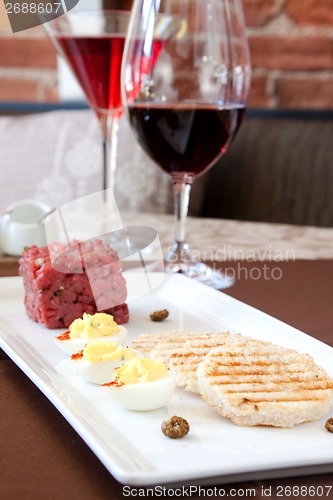 Image of Ontario Bison Tartare served with Red Wine