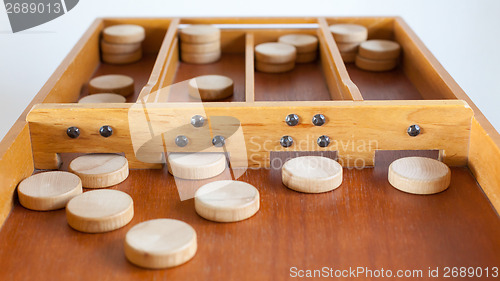 Image of Typical dutch wooden boardgame - Sjoelen