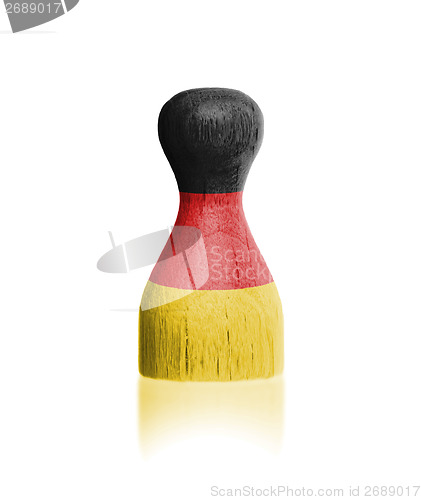 Image of Wooden pawn with a painting of a flag