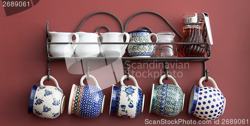 Image of Cups on a kitchen wall