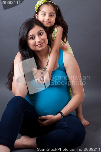 Image of Pregnant East Indian Woman with her Daughter