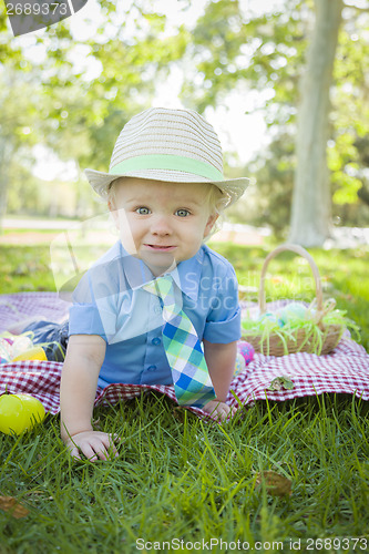 Image of Cute Little Boy Smiles With Easter Eggs Around Him 