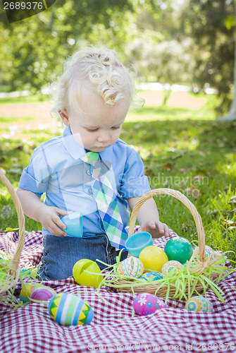 Image of Cute Little Boy Enjoying His Easter Eggs Outside in Park