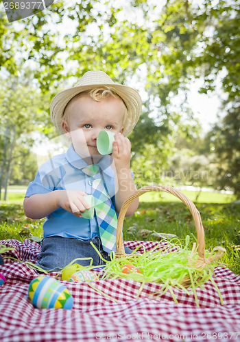 Image of Cute Little Boy Enjoying His Easter Eggs Outside in Park