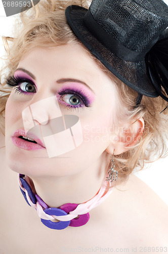 Image of Blonde beautiful female with fancy make-up and hat