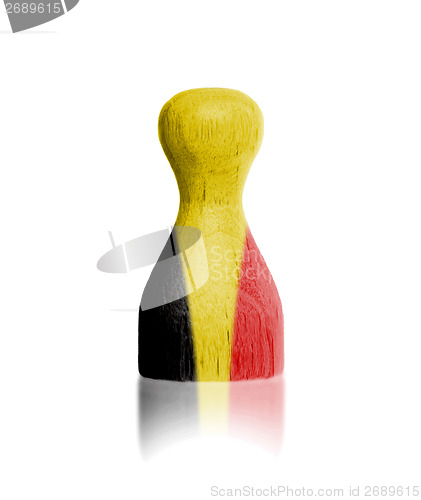 Image of Wooden pawn with a painting of a flag