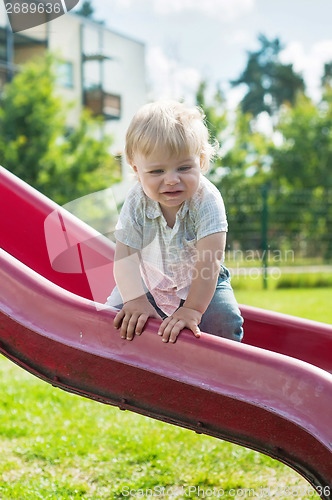 Image of Baby boy on a slide