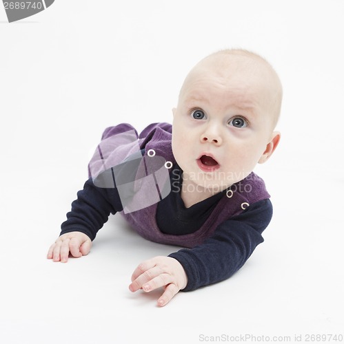 Image of surprise toddler on floor