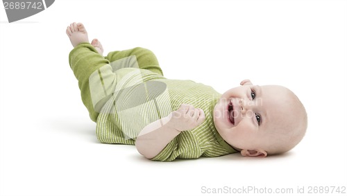 Image of happy toddler lying on his back