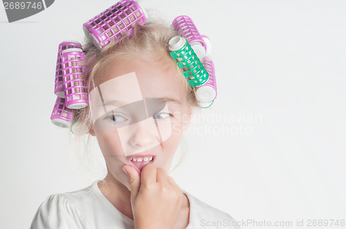 Image of Little girl in hair-curler