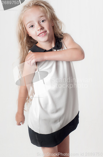 Image of Little girl in white dress