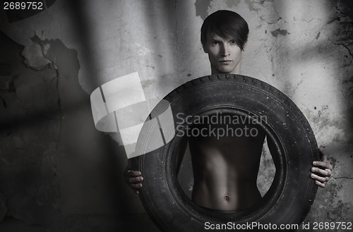 Image of Man with tire