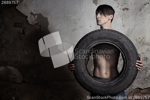 Image of Man with tire