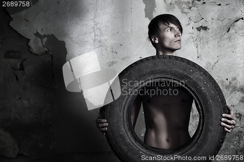 Image of Man with tire