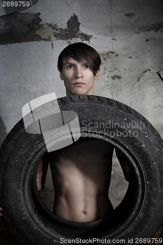 Image of Man with tire