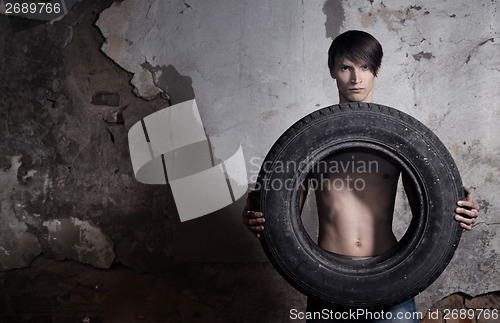 Image of Man with tire