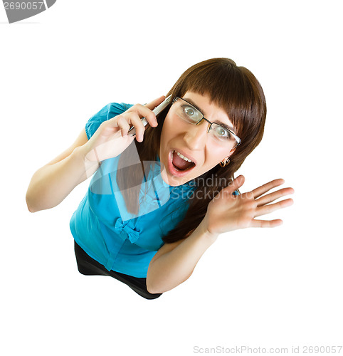 Image of Girl with glasses emotionally speaks on the phone on white backg