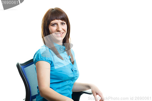 Image of Smiling attractive girl sitting on a chair against white backgro