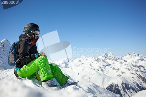 Image of woman snowboarder, Alps Mountains,