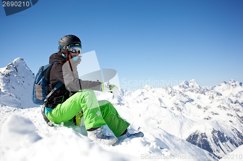 Image of woman snowboarder, Alps Mountains,