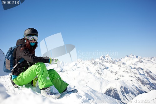 Image of woman snowboarder, Alps Mountains,