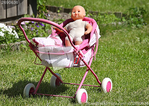 Image of Baby's doll in a carriage 