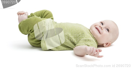 Image of happy toddler lying on his back in green clothing