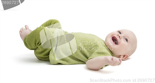 Image of happy toddler laying on back