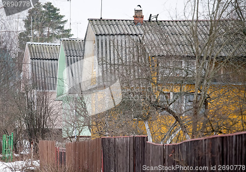 Image of countryside street with wooden houses