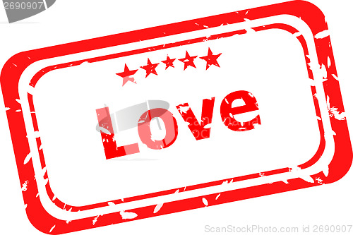 Image of Red grunge rubber stamp with the word love written inside the stamp
