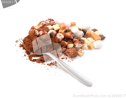 Image of Spoonful of cocoa with toppings for hot chocolate