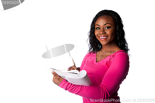 Image of Happy smart student with notebook