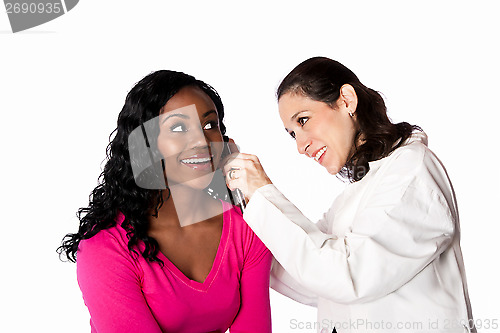 Image of Doctor checking ear for infection