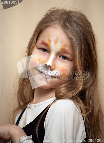 Image of little girl with cat painting makeup portrait