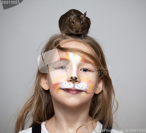 Image of girl painted as a cat with grey mouse on the head