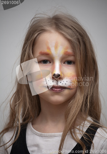 Image of little girl with cat painting makeup portrait